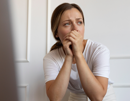Anxious woman biting her nails